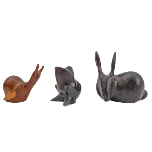 374 - JOHN MAINWARING - a collection of five hand-carved birds and animals to include a pair of swallows a... 