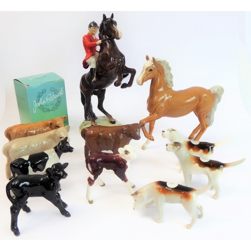 36 - Eleven pieces by Beswick:
 huntsman on a rearing horse (868);
 three foxhounds (one boxed), 
 palomi... 