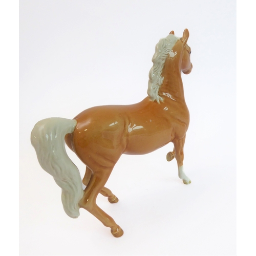 36 - Eleven pieces by Beswick:
 huntsman on a rearing horse (868);
 three foxhounds (one boxed), 
 palomi... 