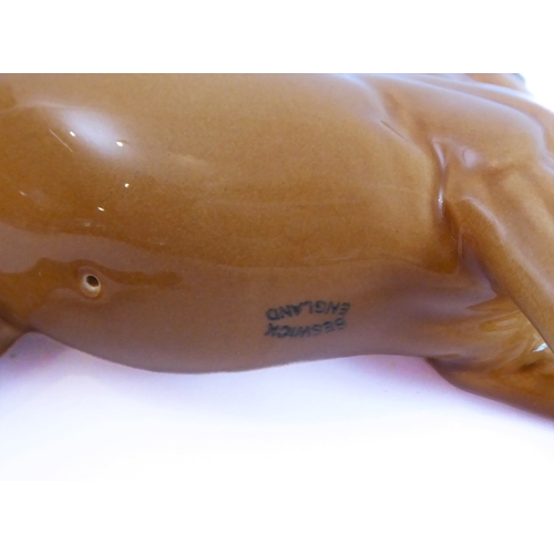 36 - Eleven pieces by Beswick:
 huntsman on a rearing horse (868);
 three foxhounds (one boxed), 
 palomi... 