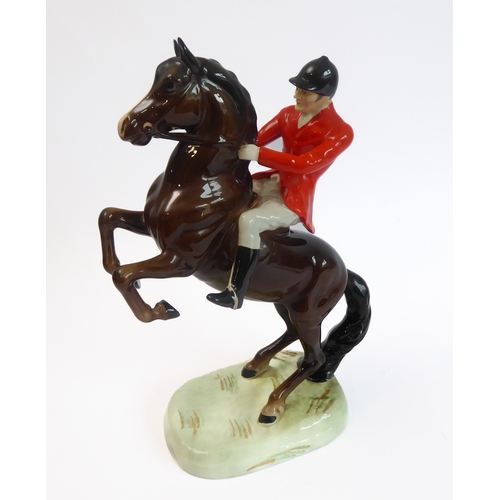 36 - Eleven pieces by Beswick:
 huntsman on a rearing horse (868);
 three foxhounds (one boxed), 
 palomi... 