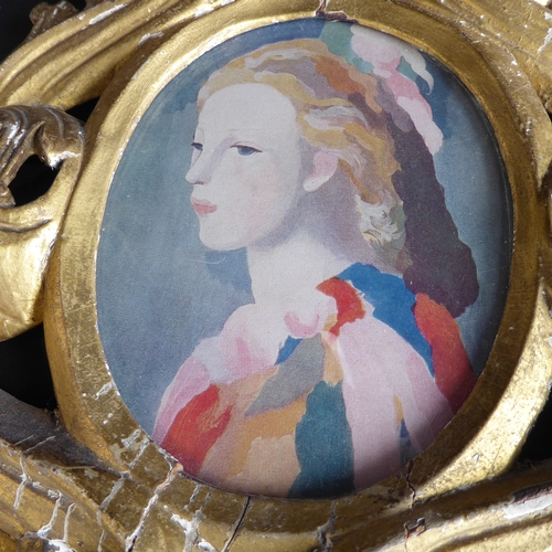 505 - A 19th century carved giltwood Florentine style picture frame: pierced in high relief with various s... 