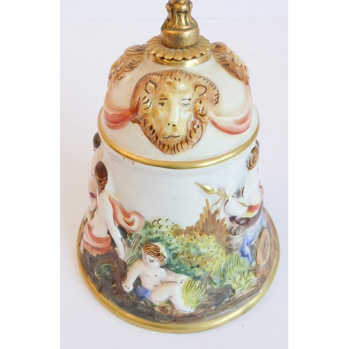 14 - A group of five comprising:
 a Capo di Monte style circular potpourri surmounted with a cherub with ... 