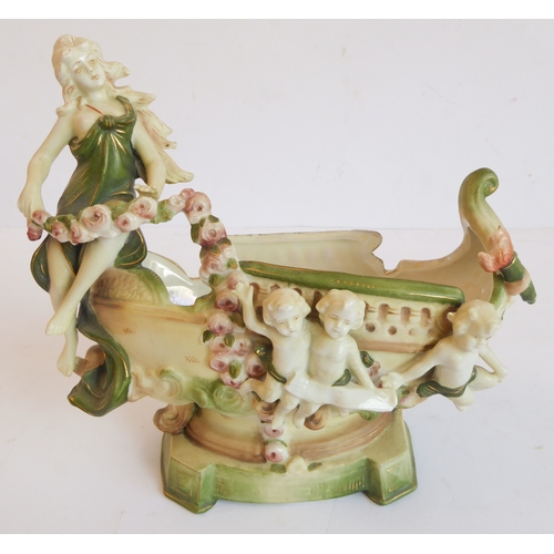 14 - A group of five comprising:
 a Capo di Monte style circular potpourri surmounted with a cherub with ... 