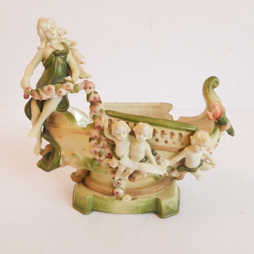 14 - A group of five comprising:
 a Capo di Monte style circular potpourri surmounted with a cherub with ... 