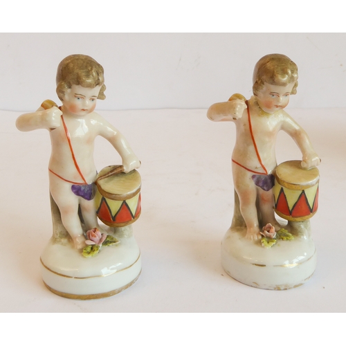 14 - A group of five comprising:
 a Capo di Monte style circular potpourri surmounted with a cherub with ... 