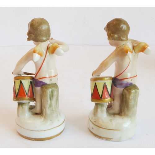 14 - A group of five comprising:
 a Capo di Monte style circular potpourri surmounted with a cherub with ... 