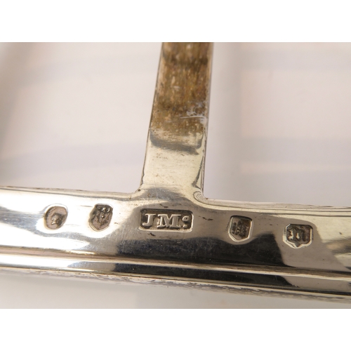 207 - A large early Victorian hallmarked silver eight-division toast-rack: the cast scrolling handle with ... 