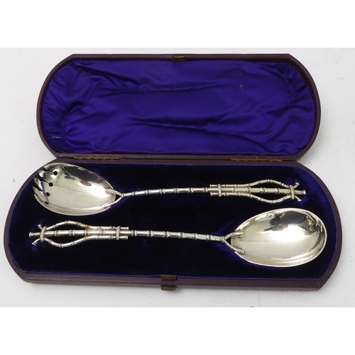 217 - A pair of late 19th century silver-plated salad servers with faux bamboo-style handles and stems, wi... 
