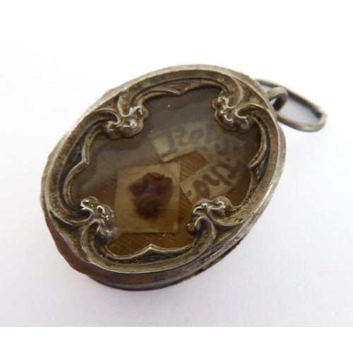 356 - A fascinating collection of seven mostly white metal and glazed religious pendant reliquaries relati... 