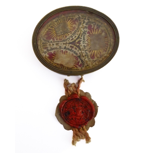 356 - A fascinating collection of seven mostly white metal and glazed religious pendant reliquaries relati... 