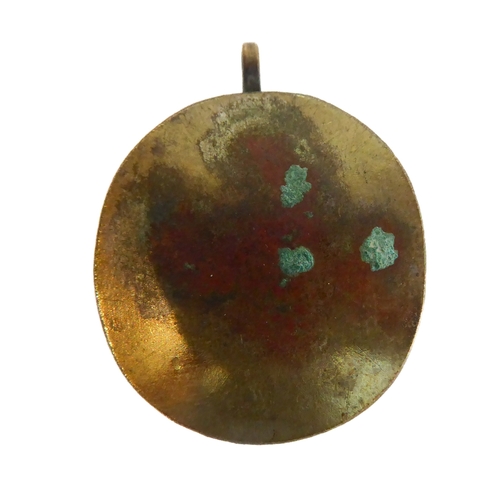 356 - A fascinating collection of seven mostly white metal and glazed religious pendant reliquaries relati... 