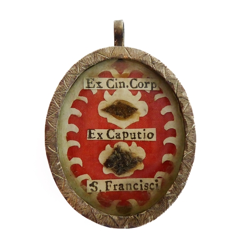 356 - A fascinating collection of seven mostly white metal and glazed religious pendant reliquaries relati... 