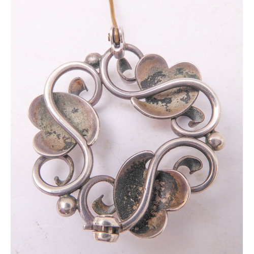 129 - A Georg Jensen design silver-coloured brooch, together with a small pair of Jensen silver leaf-desig... 