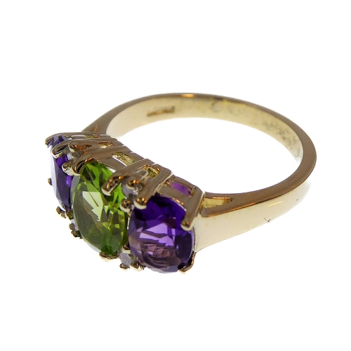 147 - A 9-carat gold suffragette style ring set with amethysts, peridots and diamonds