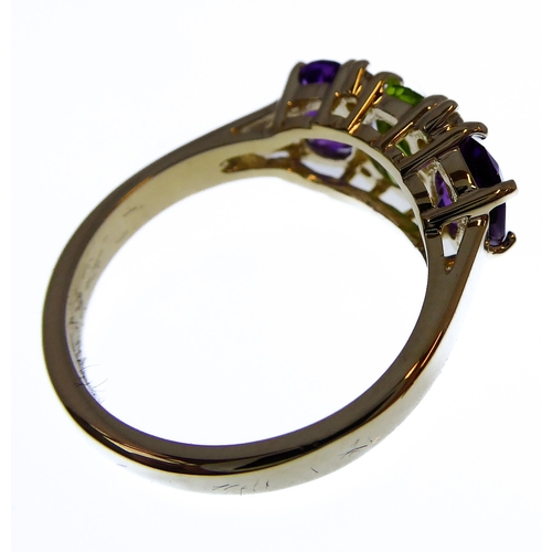 147 - A 9-carat gold suffragette style ring set with amethysts, peridots and diamonds