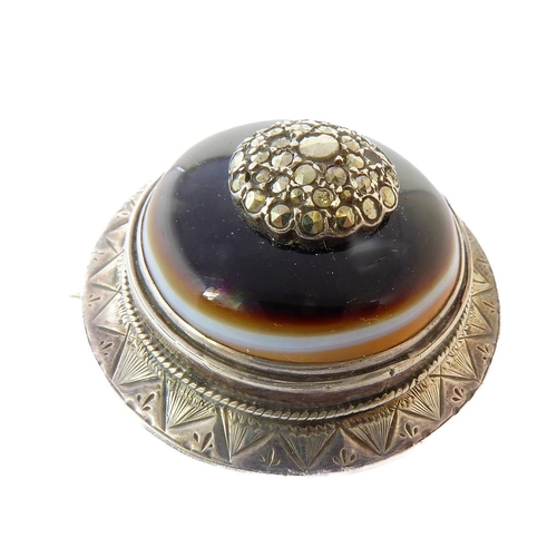 148 - An unusual 19th century Aesthetic style circular silver and hardstone-mounted brooch (boxed)