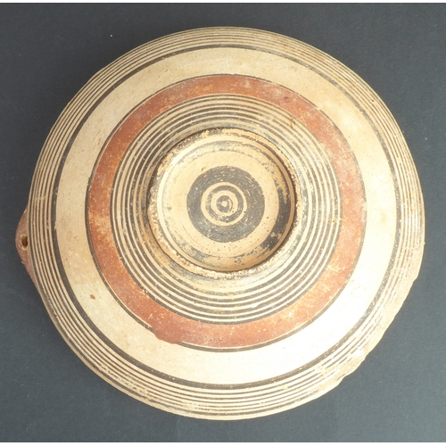 226 - A circa 1500 BC terracotta bowl, possibly Greek-Cypriot: central interior decorated with concentric ... 