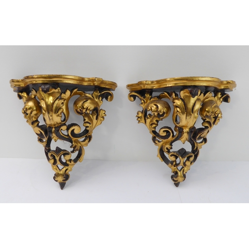 232 - A pair of mid-20th century carved giltwood wall brackets, pierced and modelled as C-scrolls and scro... 