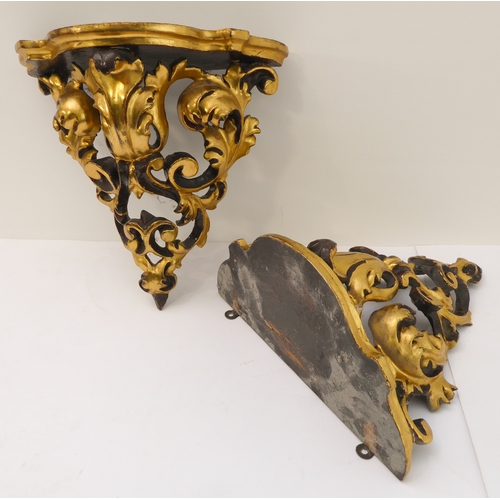 232 - A pair of mid-20th century carved giltwood wall brackets, pierced and modelled as C-scrolls and scro... 