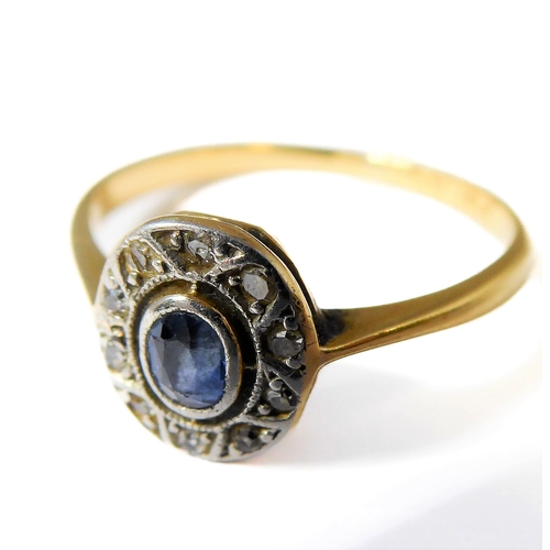 159 - A sapphire and diamond-set oval cluster ring, the tapering shank stamped 'PLAT 18CT', ring size Q (2... 
