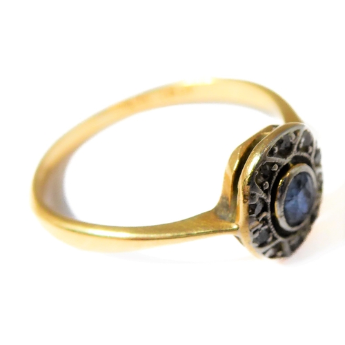 159 - A sapphire and diamond-set oval cluster ring, the tapering shank stamped 'PLAT 18CT', ring size Q (2... 