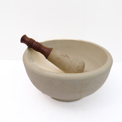 231 - A large early 20th century ceramic pestle and mortar: the pestle with two-toned turned wooden handle... 