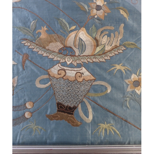 227 - A pair of silver framed and glazed (later) Chinese embroideries on silk: each depicting a central ur... 