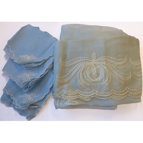 239 - A powder-blue embroidered chiffon-effect tablecloth and 12 matching napkins (tablecloth 267cm x 166c... 