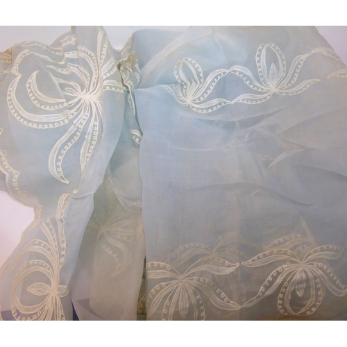 239 - A powder-blue embroidered chiffon-effect tablecloth and 12 matching napkins (tablecloth 267cm x 166c... 