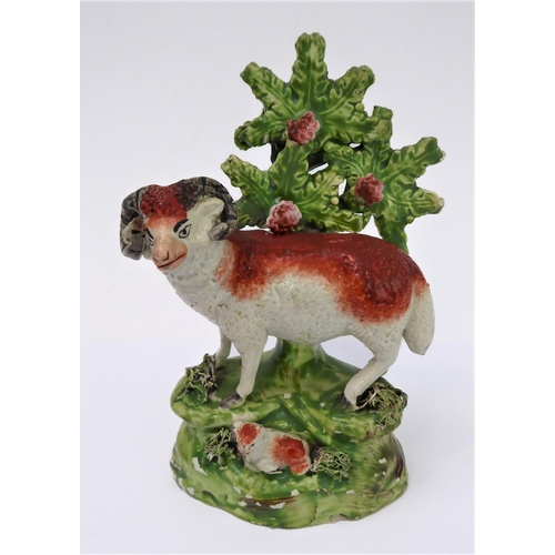 14 - Four early 19th century Staffordshire bocage figures: a ram and young stag, a recumbent stag and a r... 