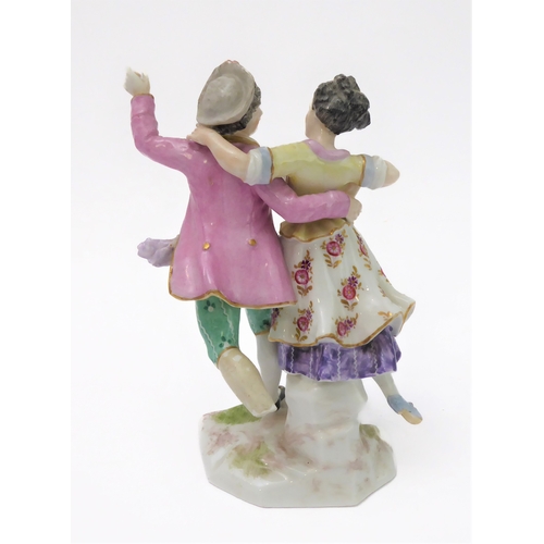 18 - Two similar 19th century hand-decorated German porcelain models of dancers; impressed marks and blue... 