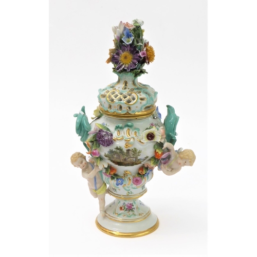 23 - A 19th century hand-decorated German porcelain potpourri: the reticulated dome-topped gilt highlight... 