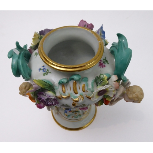 23 - A 19th century hand-decorated German porcelain potpourri: the reticulated dome-topped gilt highlight... 