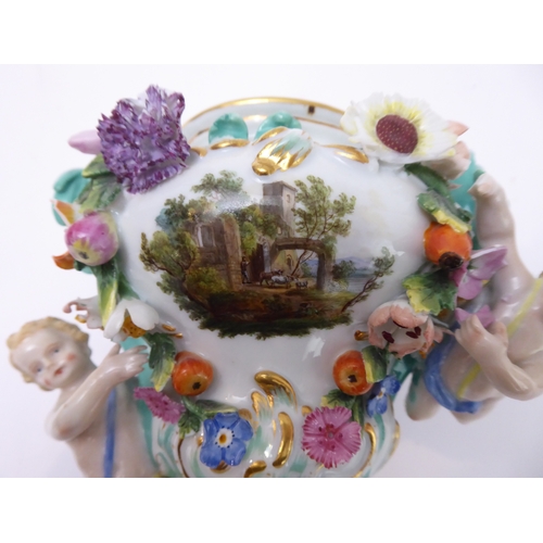 23 - A 19th century hand-decorated German porcelain potpourri: the reticulated dome-topped gilt highlight... 