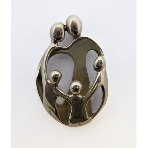 280 - A sterling silver pendant modelled as a stylised family with mother, father and three children befor... 