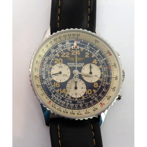 293 - A gentleman's Breitling 24-hour Cosmonaut Chronograph Wristwatch: dark blue dial with various, small... 