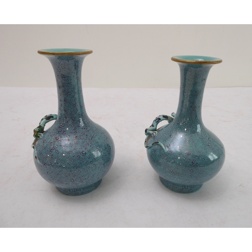 11 - An interesting pair of late 19th to early 20th century Chinese bottle vases with robin's egg glaze; ... 