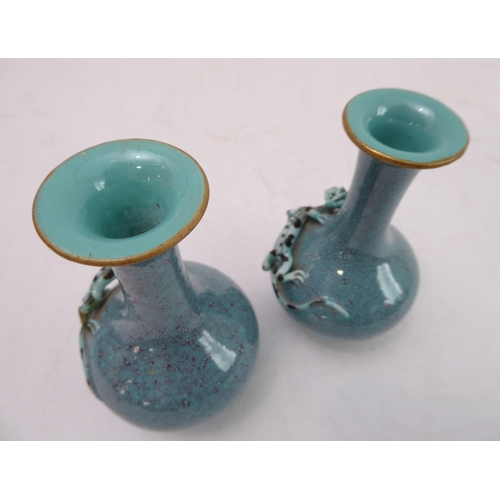 11 - An interesting pair of late 19th to early 20th century Chinese bottle vases with robin's egg glaze; ... 