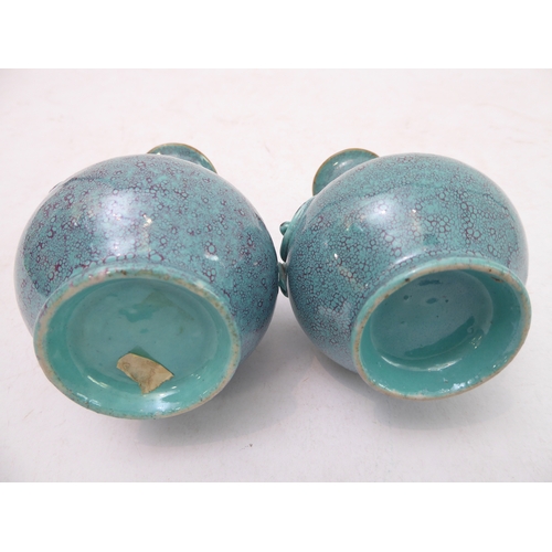 11 - An interesting pair of late 19th to early 20th century Chinese bottle vases with robin's egg glaze; ... 