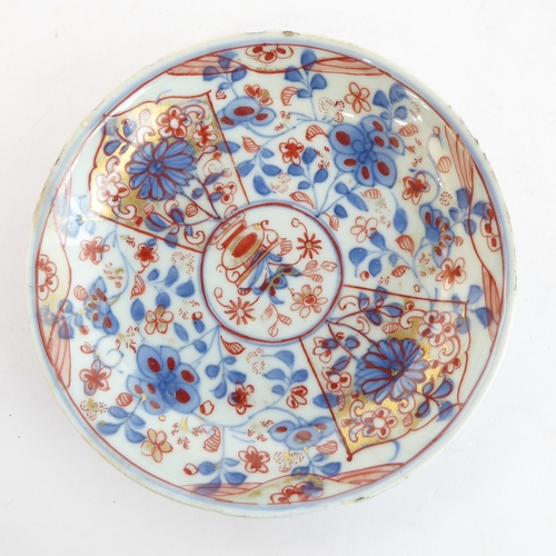 12 - Four ceramic pieces:
 1. An early 19th century fine English ceramic plate decorated in the Imari pal... 