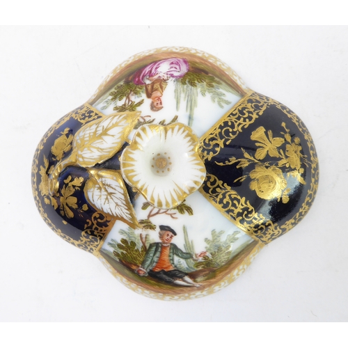 22 - A late 19th century Dresden two-handled chocolate cup and cover with original conforming stand, each... 