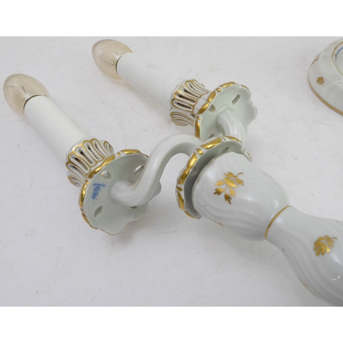 24 - A pair of early 20th century (circa 1915 - 1930) Herend porcelain two-light table candelabra decorat... 