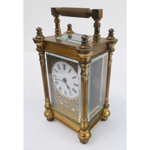 286 - An early 20th century gilt-metal and glass-sided carriage timepiece: white enamel dial with Roman nu... 