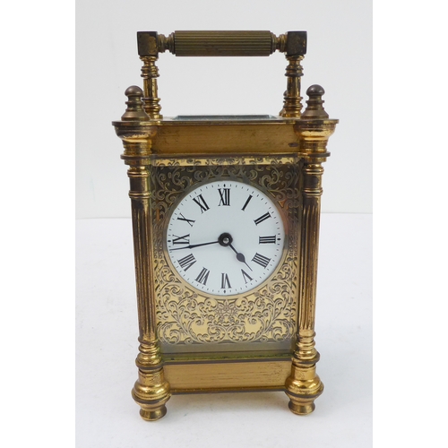 286 - An early 20th century gilt-metal and glass-sided carriage timepiece: white enamel dial with Roman nu... 