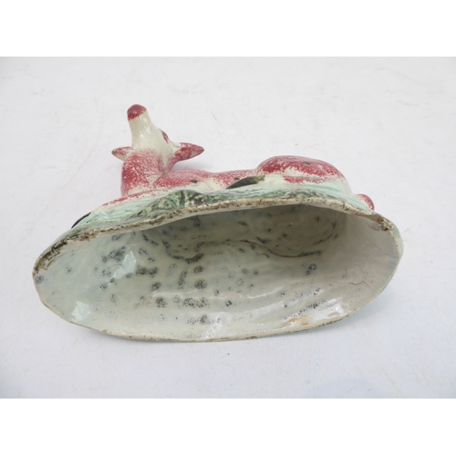 39 - A late 18th to early 19th century Staffordshire pearlware model of a recumbent deer (14 x 7.4 x 14 c... 
