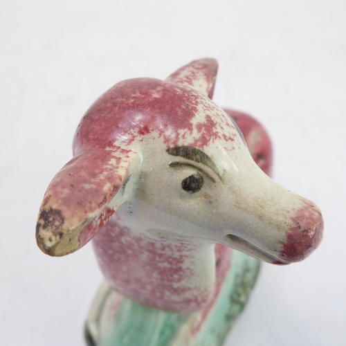 39 - A late 18th to early 19th century Staffordshire pearlware model of a recumbent deer (14 x 7.4 x 14 c... 