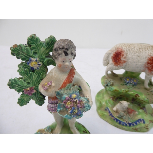 40 - Two early 19th century Walton figures: a ewe and lamb (14 cm high), and a bocage figure of a young b... 
