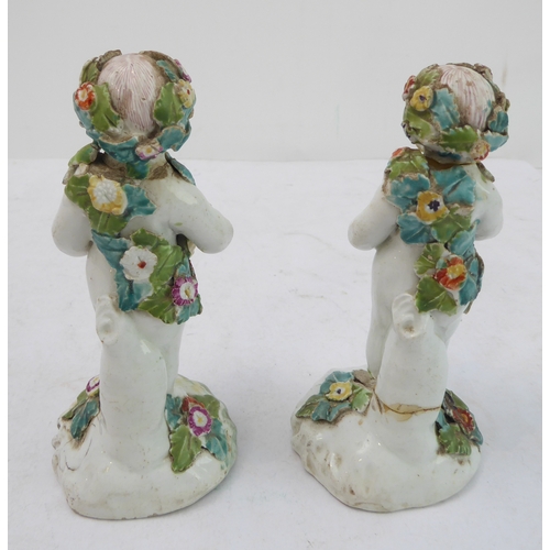 50 - A pair of early figures as children with baskets of flowers (damages) (13.5 cm high)