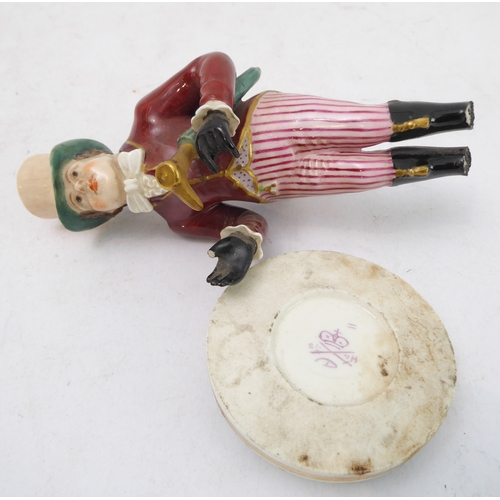 52 - Three 19th century Derby figures: 
 gentleman in top hat and striped trousers (away from the base);
... 